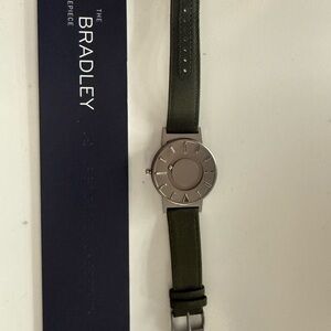 Unique watch with magnetic ball bearing time telling features.